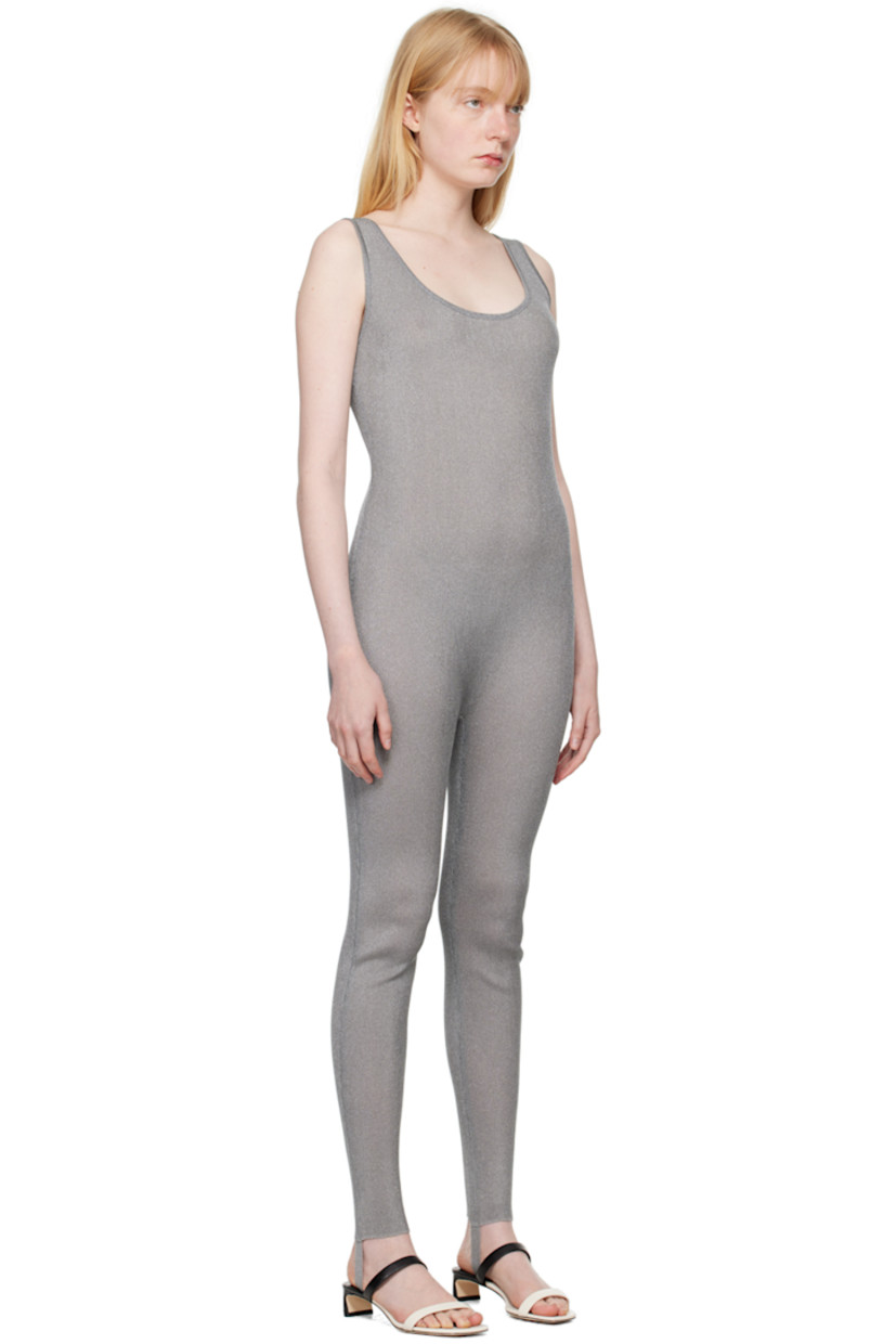 Semi-sheer rib knit nylon-blend bodysuit. Metallic thread detailing throughout.

· Scoop neck
· Stirrup at cuffs

Supplier color: Silver