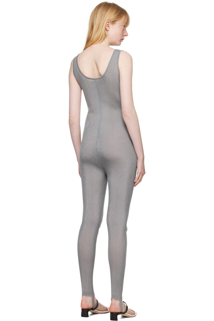 Semi-sheer rib knit nylon-blend bodysuit. Metallic thread detailing throughout.

· Scoop neck
· Stirrup at cuffs

Supplier color: Silver