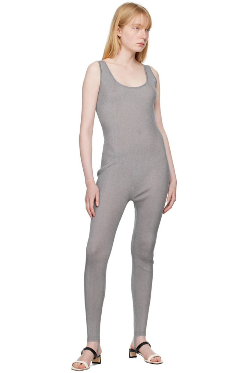 Semi-sheer rib knit nylon-blend bodysuit. Metallic thread detailing throughout.

· Scoop neck
· Stirrup at cuffs

Supplier color: Silver