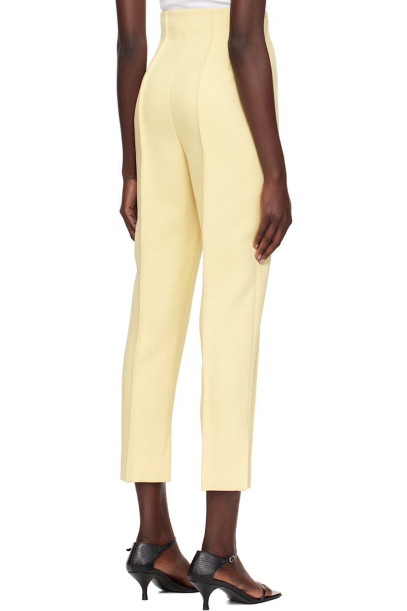Slim-fit polyester twill trousers.

· High-rise
· Single-pocket styling
· Mock zip-fly
· Pinched seams at front and back
· Vented cuffs
· Concealed zip closure at outseam

Supplier color: Vintage yellow