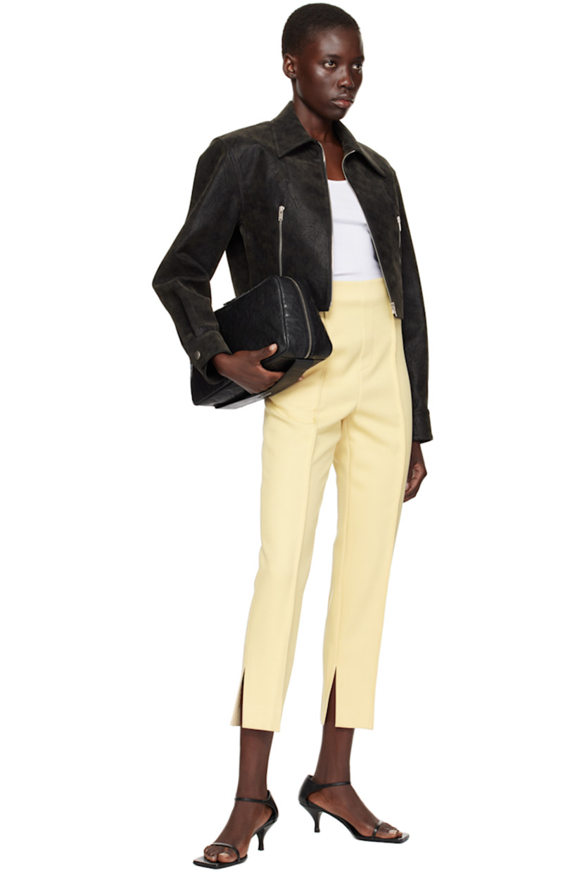 Slim-fit polyester twill trousers.

· High-rise
· Single-pocket styling
· Mock zip-fly
· Pinched seams at front and back
· Vented cuffs
· Concealed zip closure at outseam

Supplier color: Vintage yellow