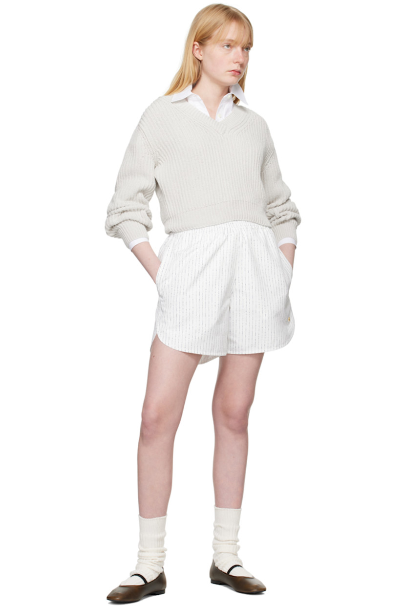 Relaxed-fit lightweight polyester taffeta shorts. Stripes throughout.

· Elasticized waistband
· Three-pocket styling
· Logo hardware at front
· Curved cuffs
· Fully lined

Supplier color: Off white