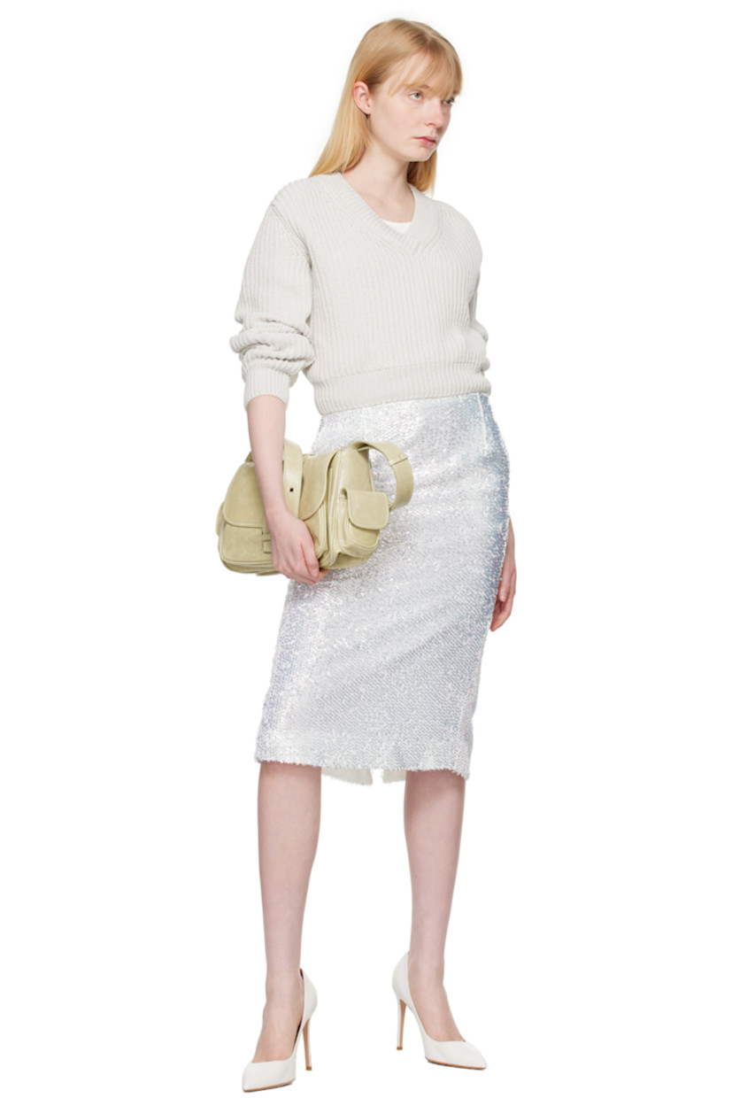 Sequinned polyester gauze skirt.

· Satin trim at elasticized waistband
· Gathering at waistband
· Zip closure at side seam
· Slit at side seam
· Fully lined

Supplier color: White