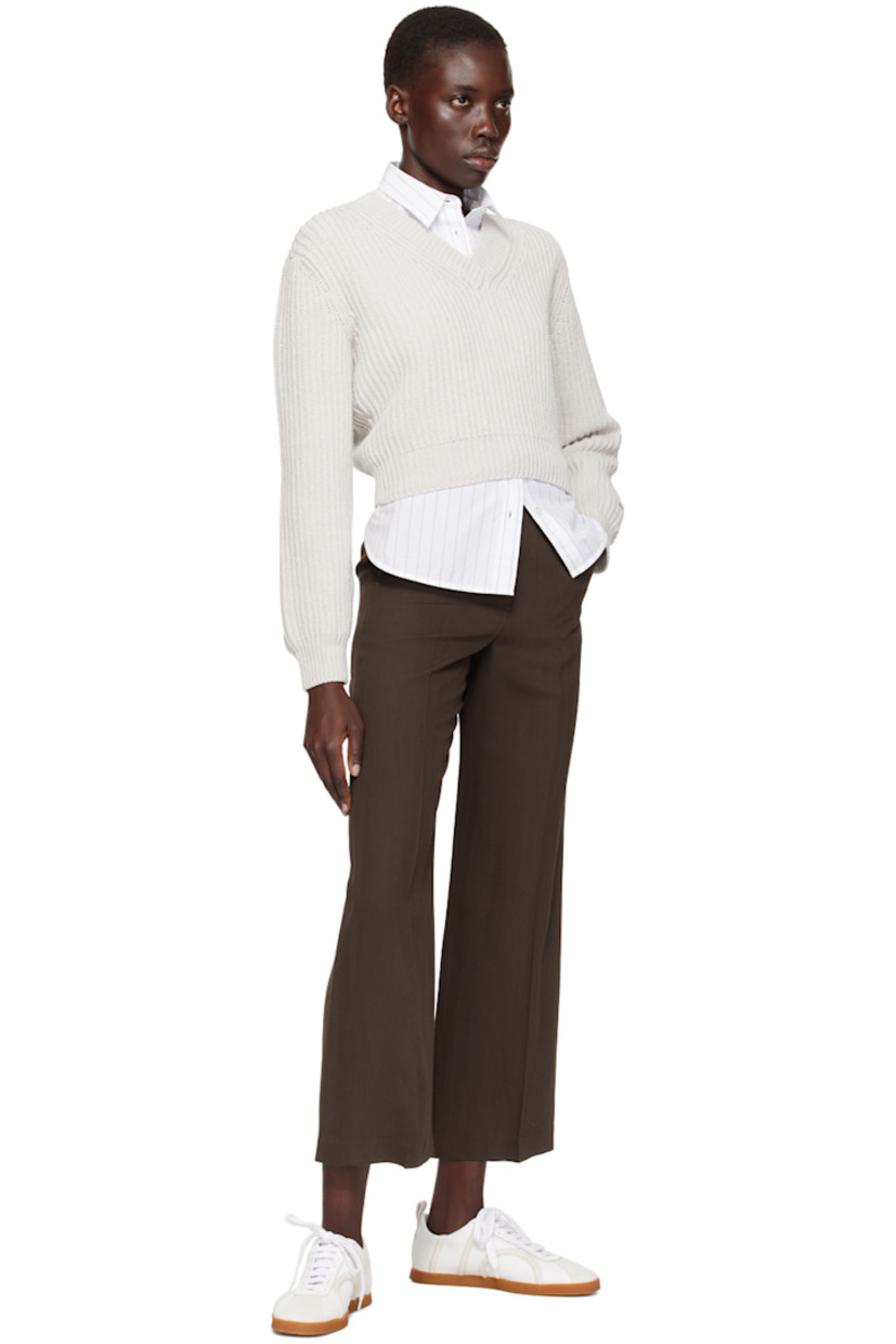 Rib knit cotton sweater.

· V-neck
· Dropped shoulders

Supplier color: White gray