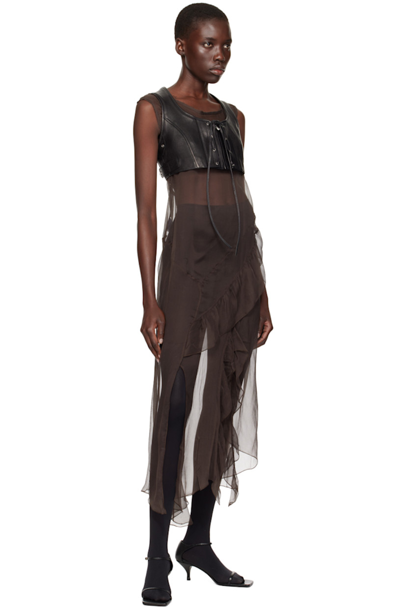 Grained goatskin vest.

· Scoop neck
· Zip closure
· Self-tie trim at front
· Eyelet at armscyes
· Adjustable button tabs at back hem
· Partial twill lining

Supplier color: Black