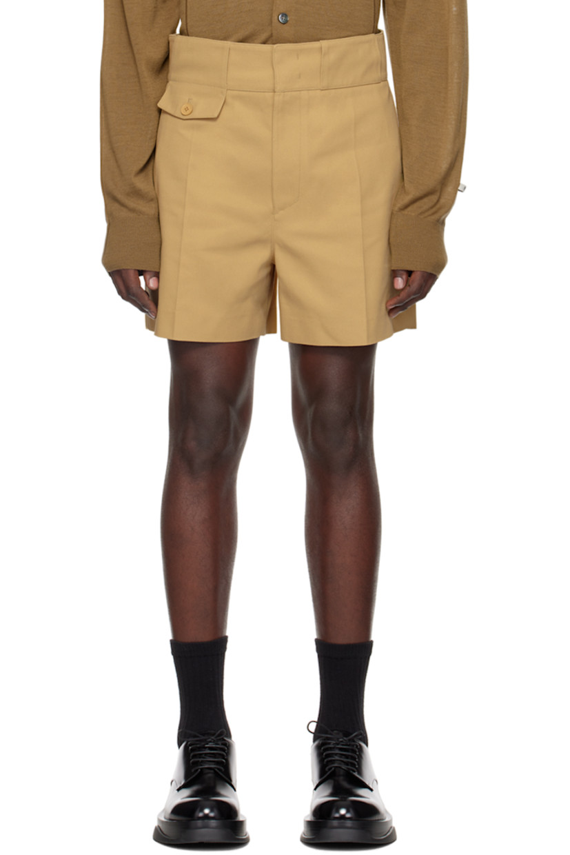 Polyester-blend drill shorts. 

· Belt loops
· Four-pocket styling
· Zip-fly
· Mock pocket at front waist
· Central crease at front legs
· Darts at back waist
· Pinched seam at back legs
· Unlined

Supplier color: Beige