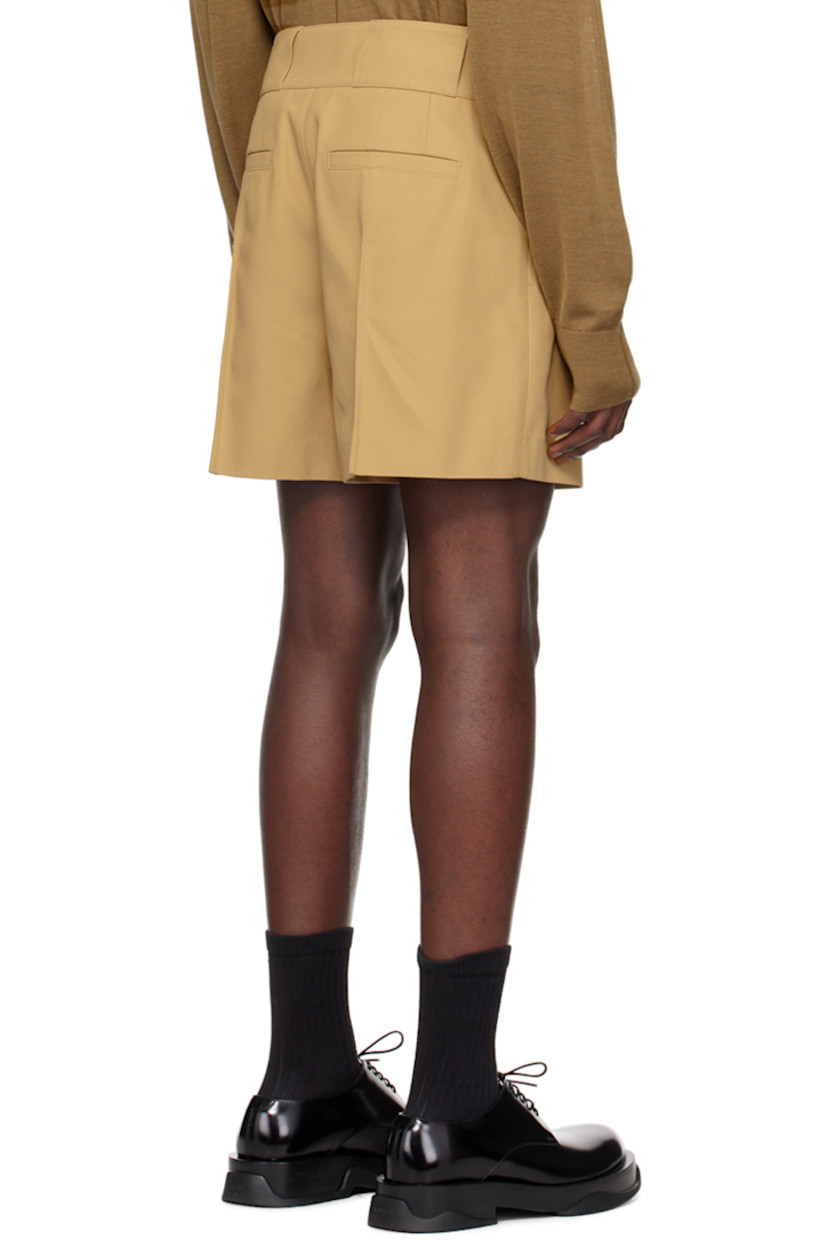 Polyester-blend drill shorts. 

· Belt loops
· Four-pocket styling
· Zip-fly
· Mock pocket at front waist
· Central crease at front legs
· Darts at back waist
· Pinched seam at back legs
· Unlined

Supplier color: Beige