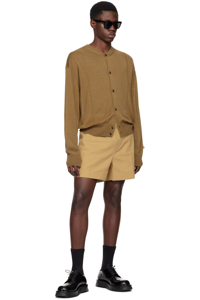 Polyester-blend drill shorts. 

· Belt loops
· Four-pocket styling
· Zip-fly
· Mock pocket at front waist
· Central crease at front legs
· Darts at back waist
· Pinched seam at back legs
· Unlined

Supplier color: Beige
