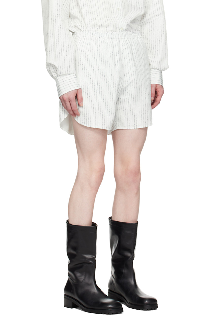 Polyester taffeta shorts. Stripes throughout.

· Elasticized waistband 
· Three-pocket styling 
· Logo hardware at cuff
· Curved cuffs 
· Full taffeta lining 

Supplier color: Off white