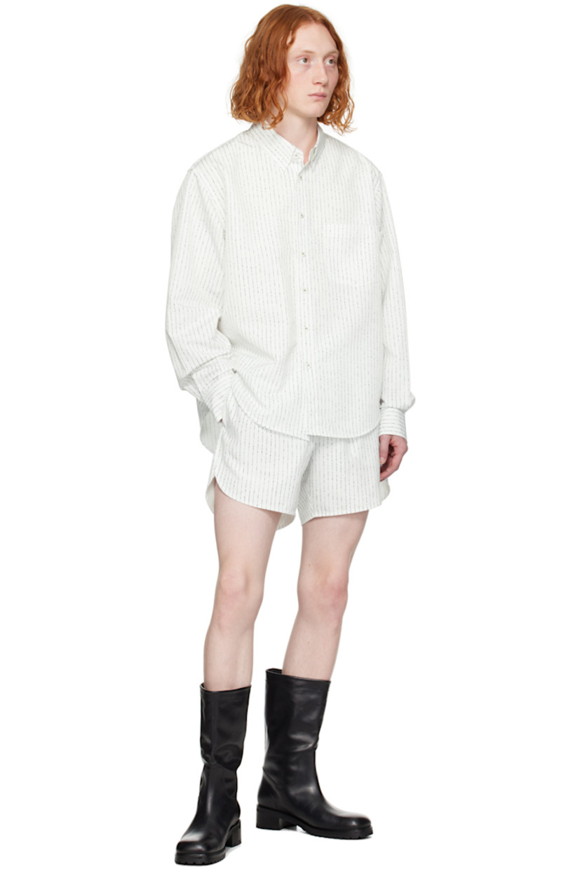 Polyester taffeta shorts. Stripes throughout.

· Elasticized waistband 
· Three-pocket styling 
· Logo hardware at cuff
· Curved cuffs 
· Full taffeta lining 

Supplier color: Off white