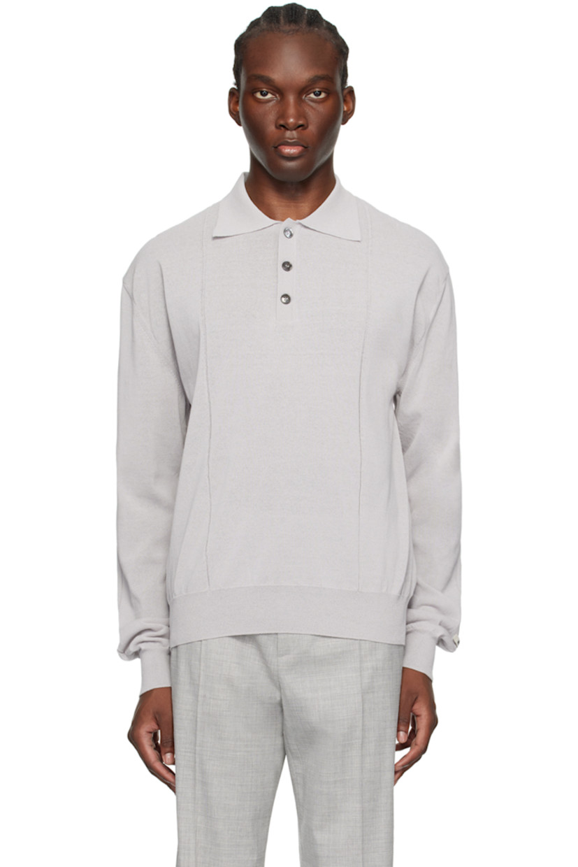Semi-sheer lightweight knit cotton-blend polo.

· Spread collar
· Three-button placket
· Rib knit hem and cuffs
· Dropped shoulders
· Logo patch at cuff

Supplier color: Light grey