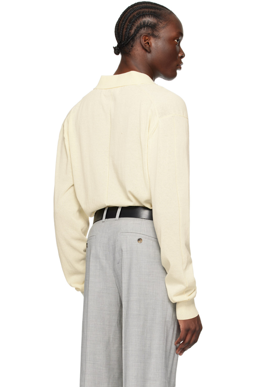 Semi-sheer knit cotton-blend polo. Garter stitch stripes throughout.

· Rib knit spread collar, hem, and cuffs
· Three-button placket
· Logo patch at cuff

Supplier color: Cream