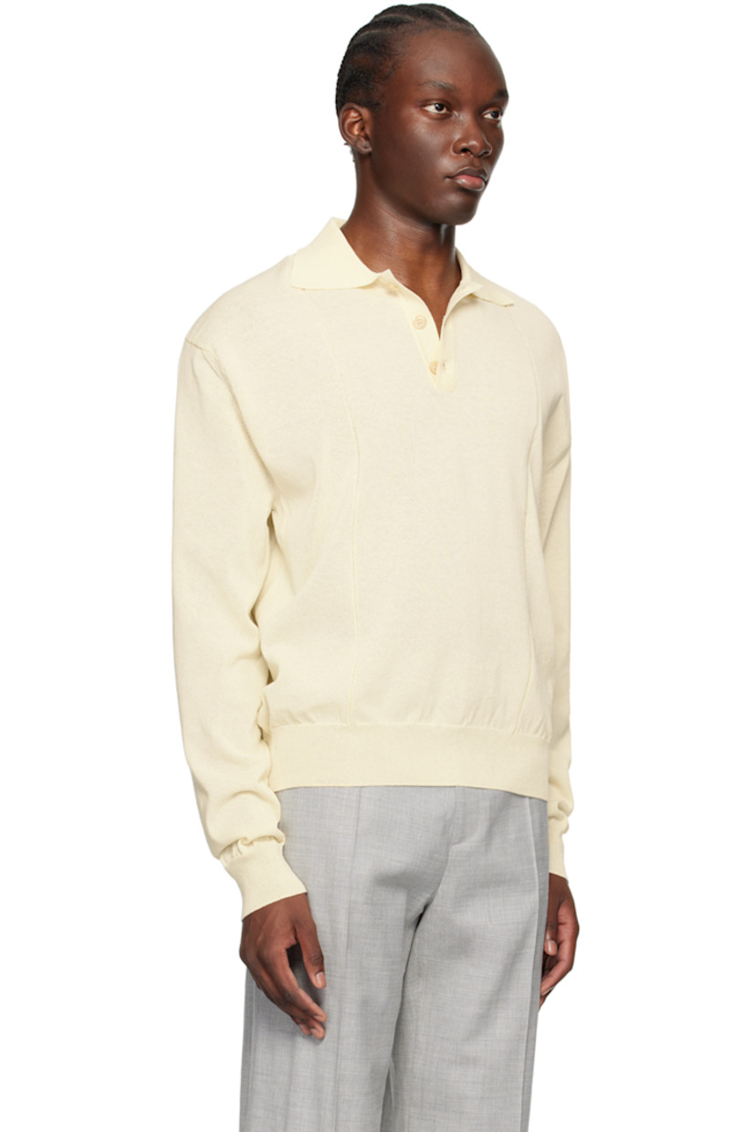 Semi-sheer knit cotton-blend polo. Garter stitch stripes throughout.

· Rib knit spread collar, hem, and cuffs
· Three-button placket
· Logo patch at cuff

Supplier color: Cream