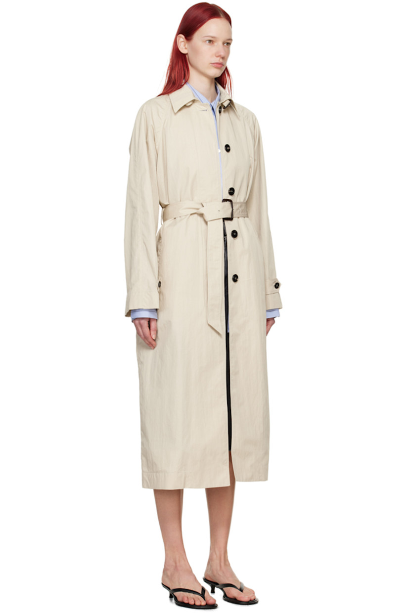 Crinkled cotton- and nylon-blend twill trench coat.

· Pin-buckle strap at spread collar
· Concealed button placket
· Pin-buckle belt at waist
· Welt pockets
· Raglan sleeves
· Button tab at cuffs
· Central vent at back hem
· Unlined

Supplier color: Light beige