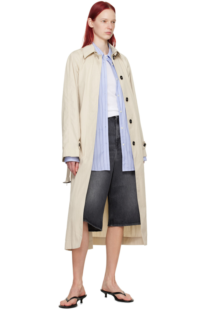 Crinkled cotton- and nylon-blend twill trench coat.

· Pin-buckle strap at spread collar
· Concealed button placket
· Pin-buckle belt at waist
· Welt pockets
· Raglan sleeves
· Button tab at cuffs
· Central vent at back hem
· Unlined

Supplier color: Light beige