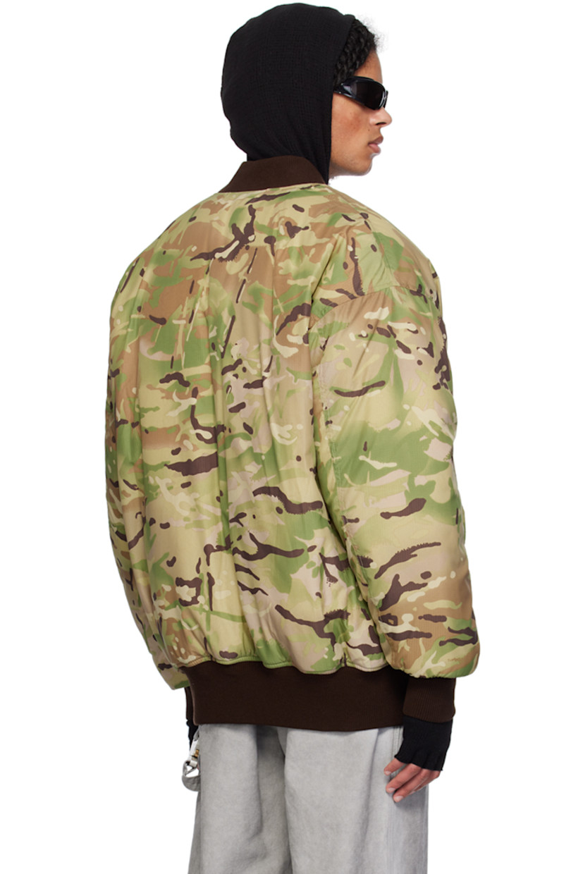 Padded nylon ripstop bomber jacket. Camouflage pattern printed throughout. 

· Rib knit band collar, hem, and cuffs
· Zip closure
· Logo hardware and strap at chest
· Flap pockets
· Utility pocket at sleeve
· Welt pocket at interior
· Full satin lining

Supplier color: Camo