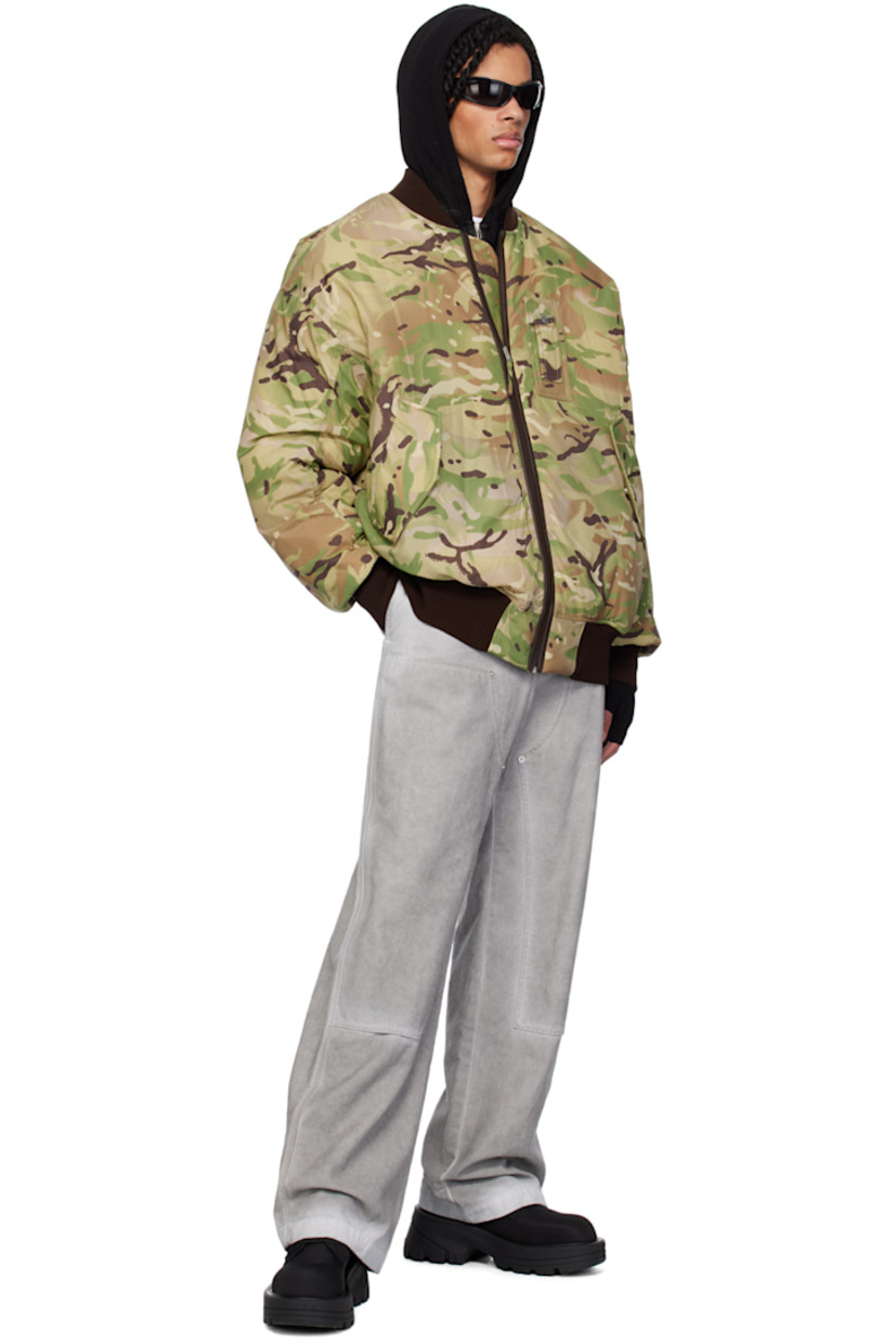 Padded nylon ripstop bomber jacket. Camouflage pattern printed throughout. 

· Rib knit band collar, hem, and cuffs
· Zip closure
· Logo hardware and strap at chest
· Flap pockets
· Utility pocket at sleeve
· Welt pocket at interior
· Full satin lining

Supplier color: Camo