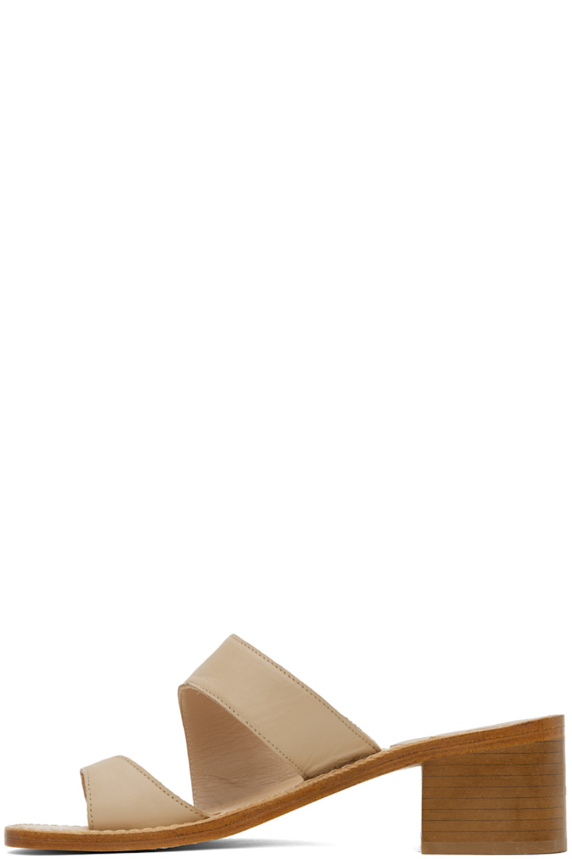 Grained calfskin heeled sandals in beige.

· Thong-style strap at open toe
· Strap at vamp
· Logo embossed at footbed
· Topstitching at welt
· Stacked leather block heel with rubber injection
· Leather sole
· Heel: H2"

Supplier color: Camel calf