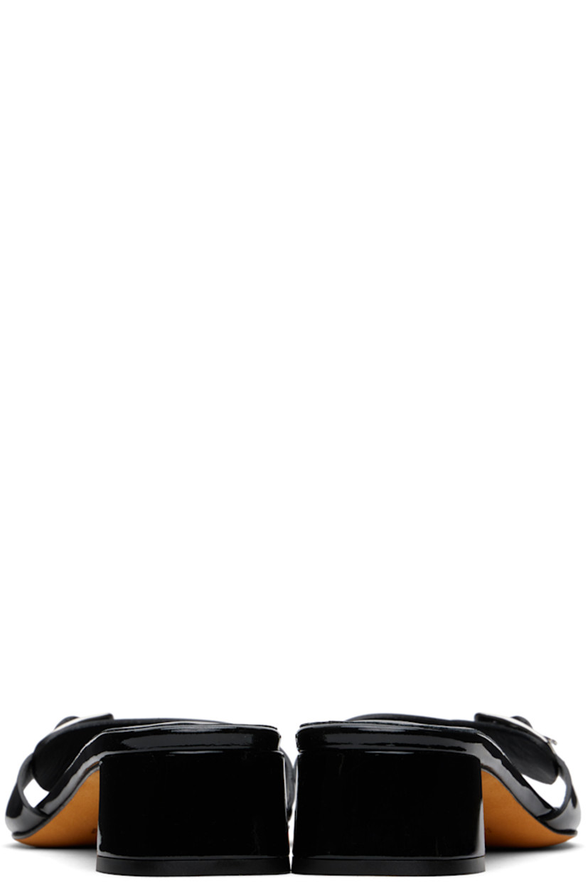 Patent leather heeled sandals in black.

· Open square toe
· Pin-buckle strap at vamp
· Logo embossed at padded leather footbed
· Grained leather lining
· Covered block heel with rubber injection
· Nubuck sole
· Heel: H1.25"

Supplier color: Black