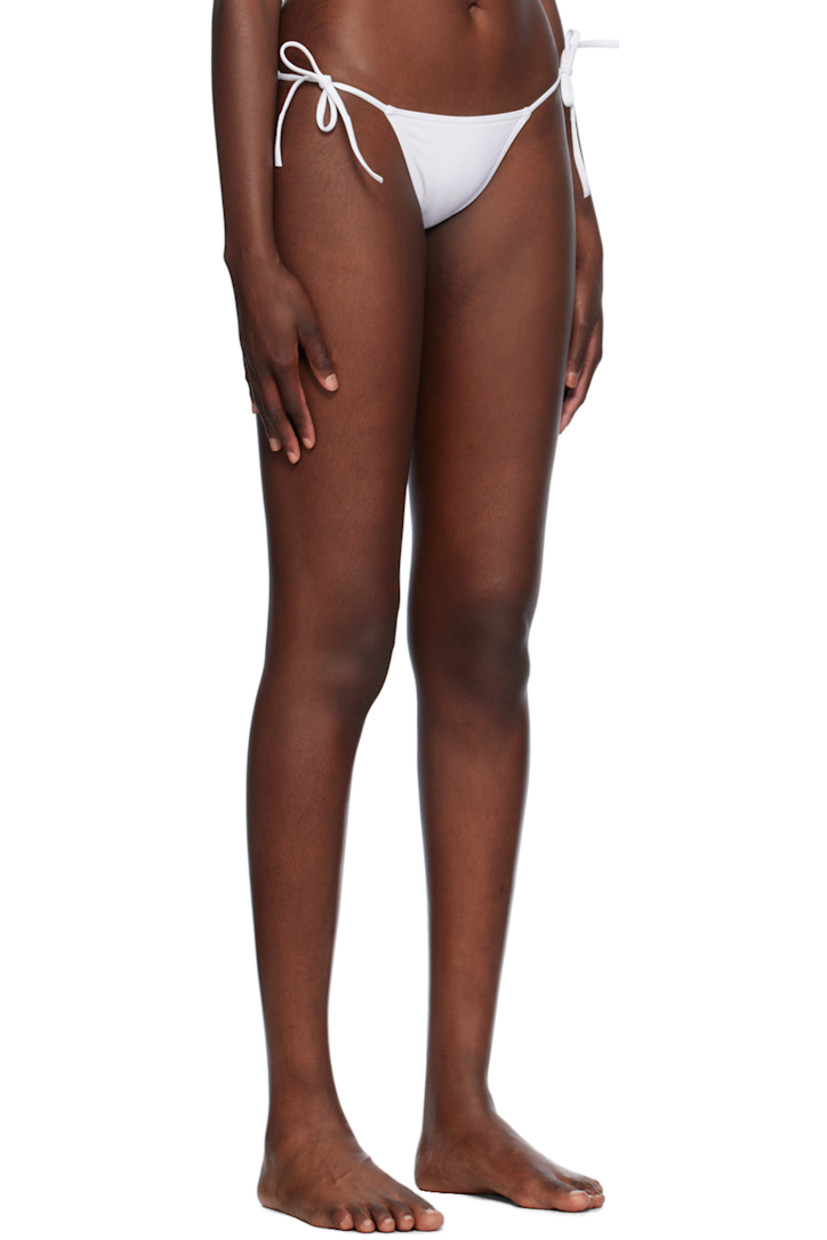 Stretch nylon jersey bikini bottom. 

· Self-tie fastening at sides
· Partially lined

Supplier color: Blanc