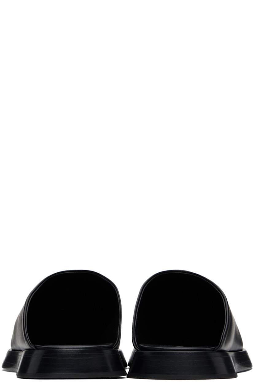 Nappa leather slip-on mules in black.

· Logo embossed at padded leather footbed
· Hand-stitched stacked wood sole with rubber injection

Supplier color: Black