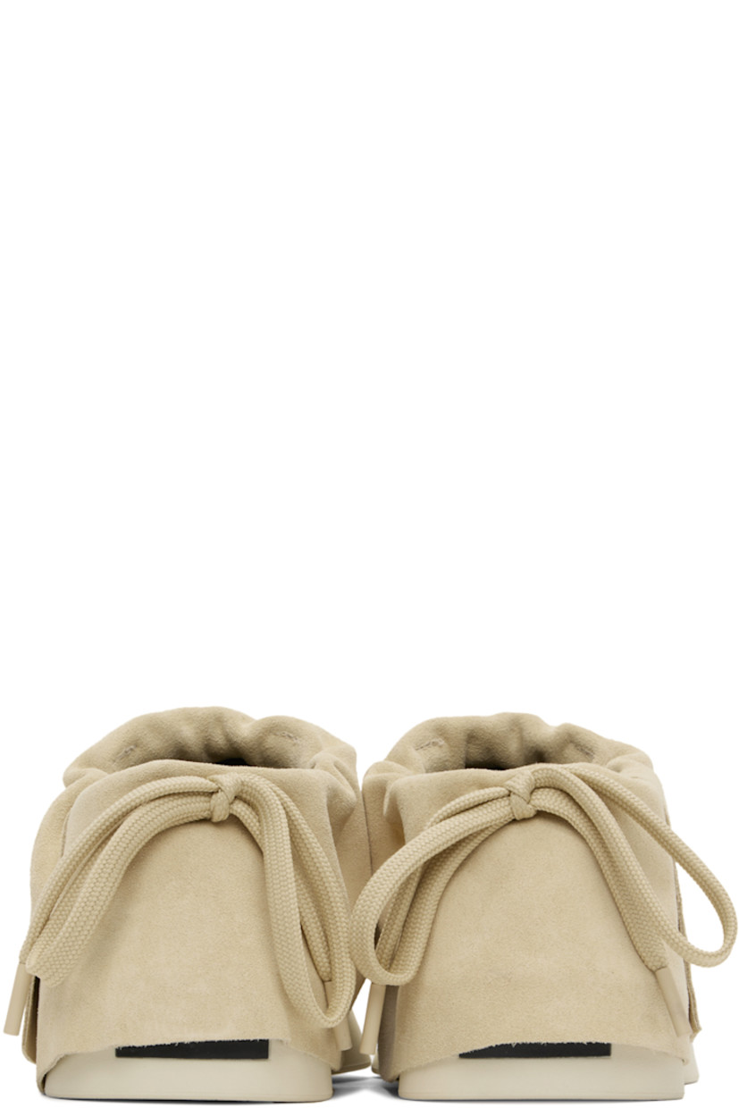 Low-top suede sneakers in beige. 

· Drawstring at padded foldover collar
· Neoprene and mesh lining
· Rubberized logo patch at heel 
· Rubber sole

Supplier color: Sand