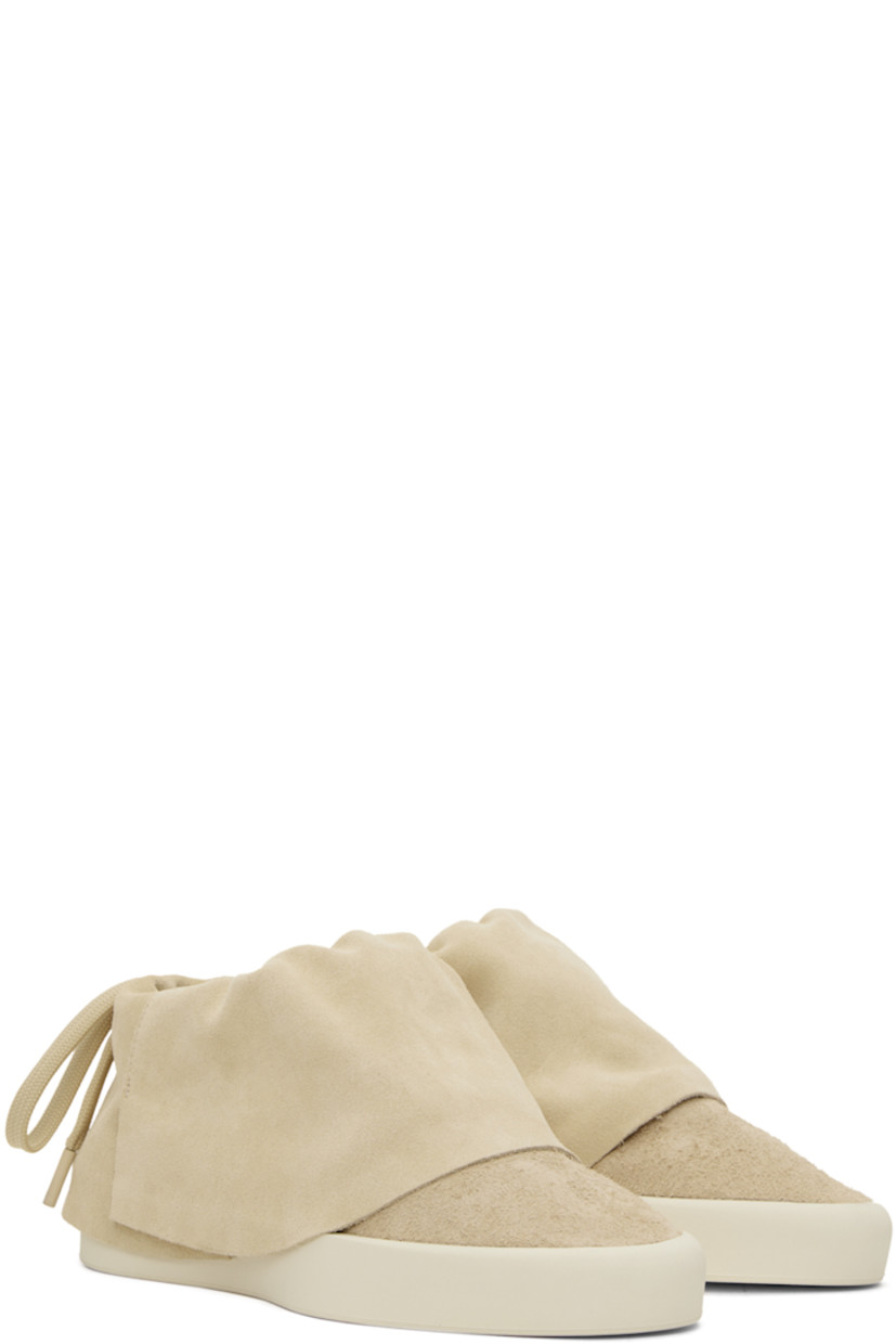 Low-top suede sneakers in beige. 

· Drawstring at padded foldover collar
· Neoprene and mesh lining
· Rubberized logo patch at heel 
· Rubber sole

Supplier color: Sand