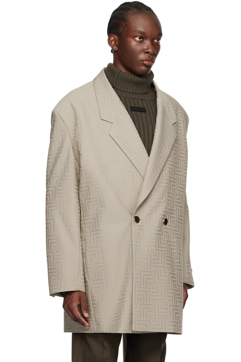Virgin wool- and polyester-blend twill blazer. Jacquard graphic pattern throughout. 

· Notched lapel
· Double-breasted button closure
· Seam pockets
· Logo patch at cuff
· Buttoned vent at cuffs
· Locker loop at back collar
· Welt pockets at interior 
· Full satin lining
· Horn hardware

Supplier color: Dove grey