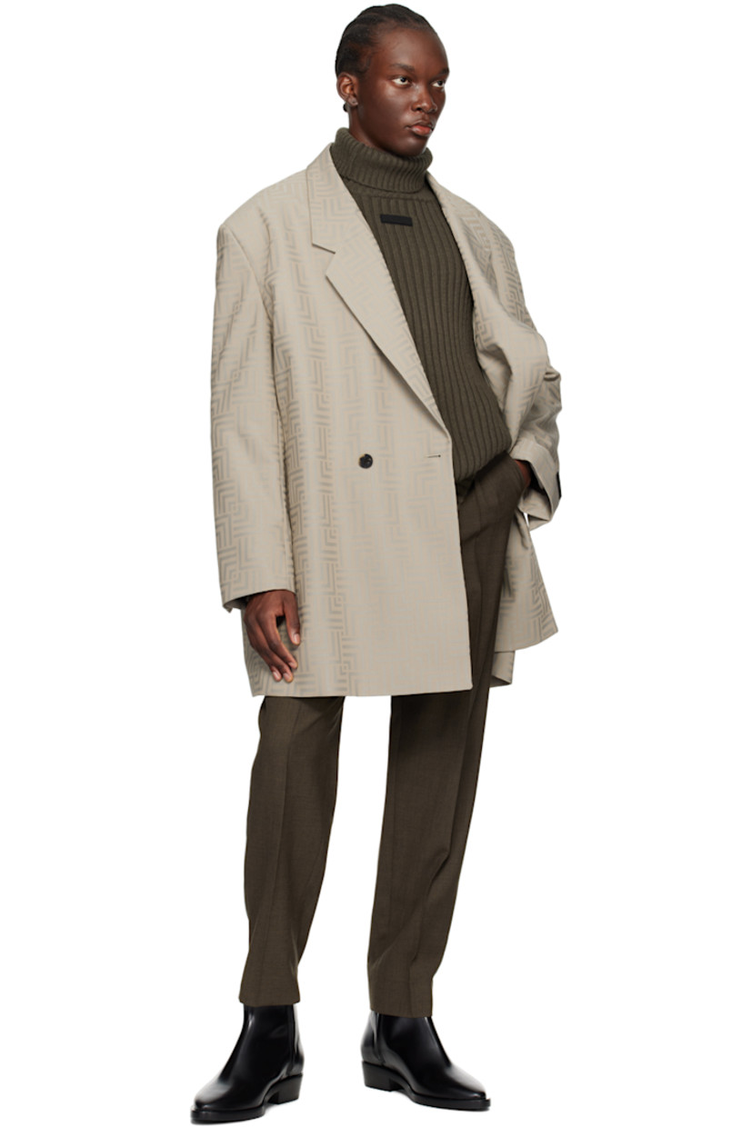 Virgin wool- and polyester-blend twill blazer. Jacquard graphic pattern throughout. 

· Notched lapel
· Double-breasted button closure
· Seam pockets
· Logo patch at cuff
· Buttoned vent at cuffs
· Locker loop at back collar
· Welt pockets at interior 
· Full satin lining
· Horn hardware

Supplier color: Dove grey