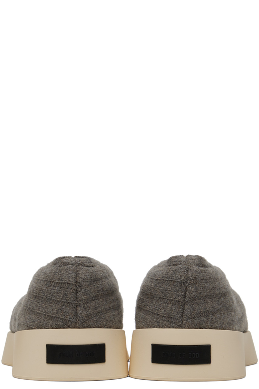 Low-top rib knit wool sneakers in taupe.

· Elasticized collar
· Neoprene lining
· Rubberized logo patch at heel 
· Rubber sole

Supplier color: Taupe