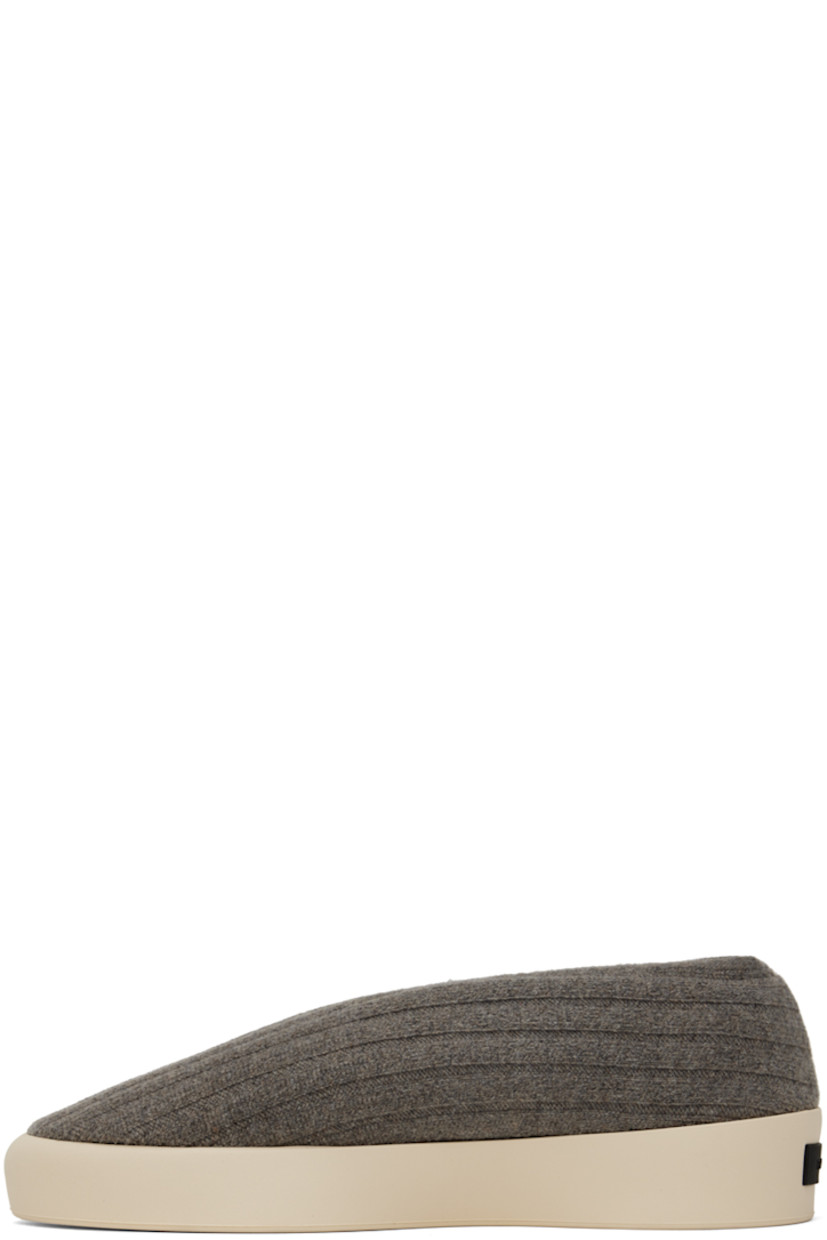 Low-top rib knit wool sneakers in taupe.

· Elasticized collar
· Neoprene lining
· Rubberized logo patch at heel 
· Rubber sole

Supplier color: Taupe