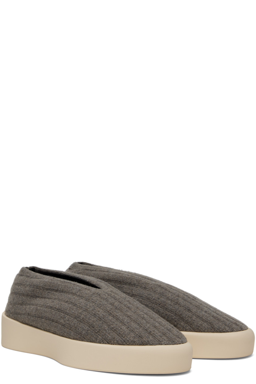 Low-top rib knit wool sneakers in taupe.

· Elasticized collar
· Neoprene lining
· Rubberized logo patch at heel 
· Rubber sole

Supplier color: Taupe
