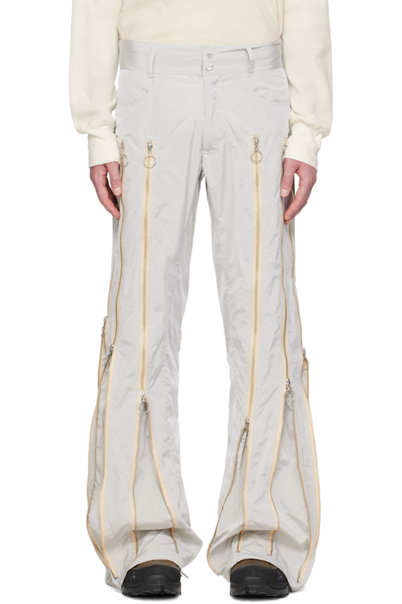 Nylon taffeta trousers. Two-way zip expansion panels throughout for alternate styling.

· Belt loops
· Two-pocket styling
· Logo hardware at zip-fly

Each item is unique. Please note that coloration may vary. 

Available exclusively at SSENSE.

Supplier color: Grey/Silver