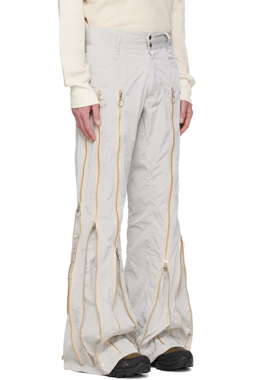 Nylon taffeta trousers. Two-way zip expansion panels throughout for alternate styling.

· Belt loops
· Two-pocket styling
· Logo hardware at zip-fly

Each item is unique. Please note that coloration may vary. 

Available exclusively at SSENSE.

Supplier color: Grey/Silver