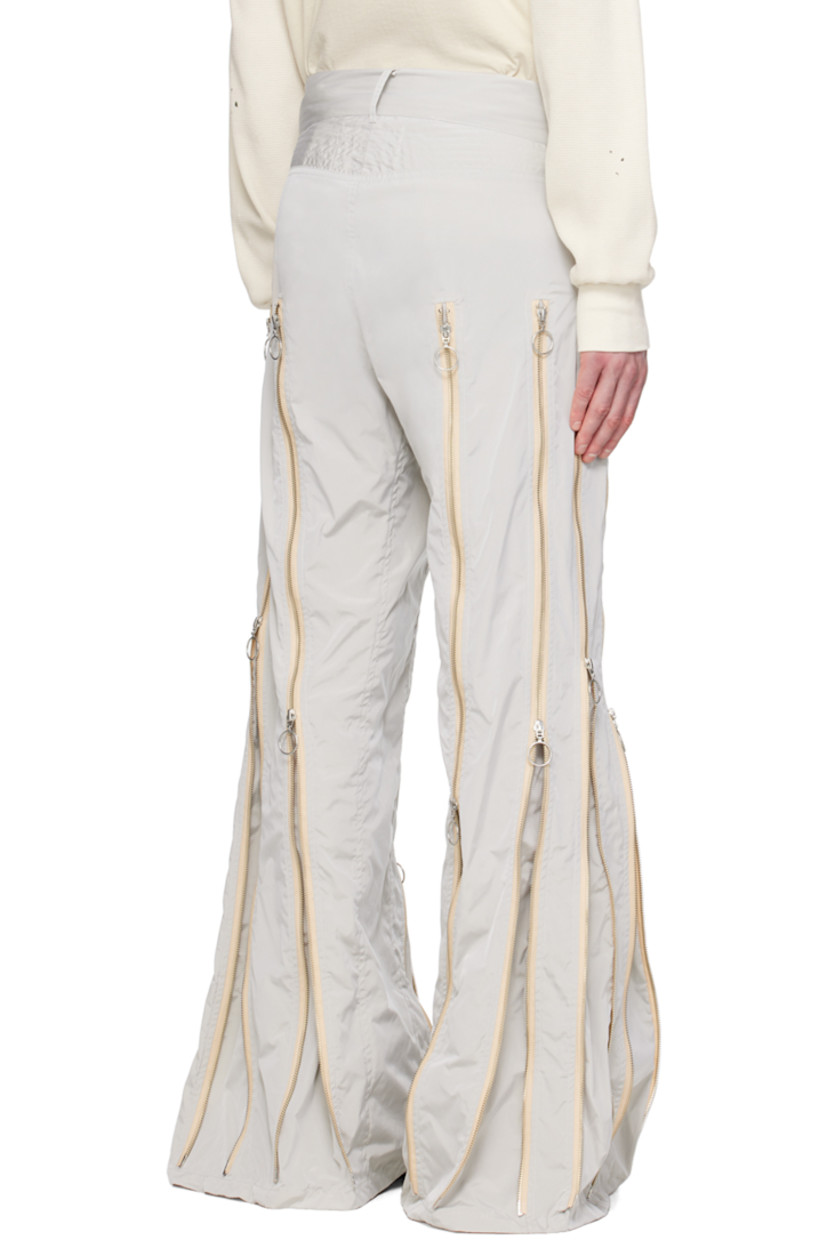 Nylon taffeta trousers. Two-way zip expansion panels throughout for alternate styling.

· Belt loops
· Two-pocket styling
· Logo hardware at zip-fly

Each item is unique. Please note that coloration may vary. 

Available exclusively at SSENSE.

Supplier color: Grey/Silver