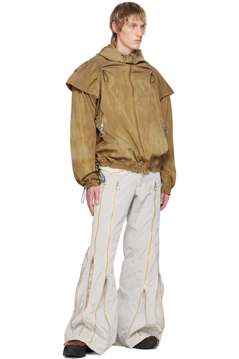 Nylon taffeta trousers. Two-way zip expansion panels throughout for alternate styling.

· Belt loops
· Two-pocket styling
· Logo hardware at zip-fly

Each item is unique. Please note that coloration may vary. 

Available exclusively at SSENSE.

Supplier color: Grey/Silver
