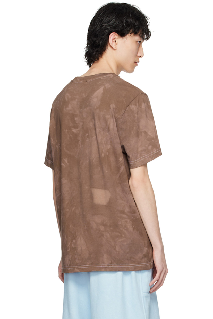 Garment-dyed cotton jersey T-shirt. Fading throughout. 

· Rib knit crewneck
· Graphics flocked at front 
· Contrast stitching in white 

Supplier color: Dark brown garment dye