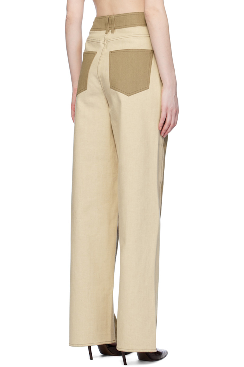 Straight-fit stretch denim jeans.

· Paneled construction
· Belt loops
· Five-pocket styling
· Zip-fly
· Twisted outseams

Supplier color: Khaki