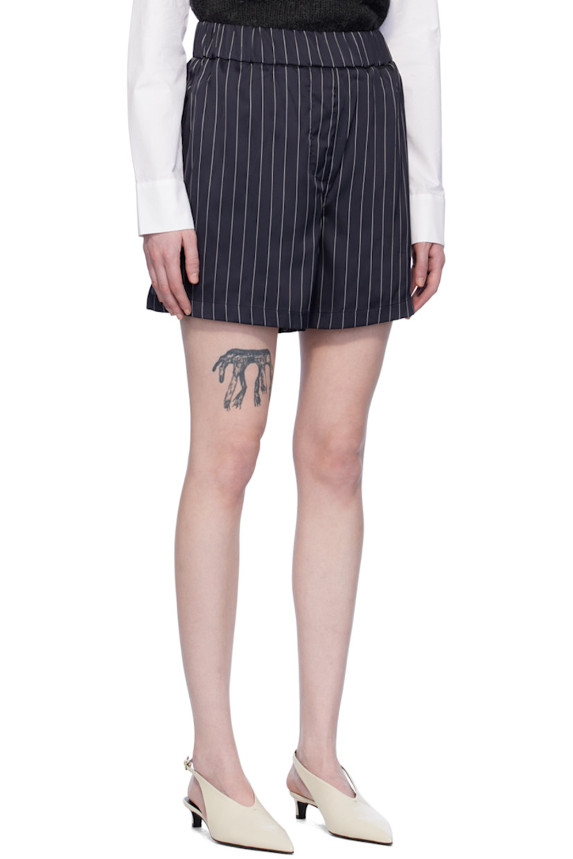 Stretch polyester satin shorts. Stripes throughout.

· Elasticized waistband
· Two-pocket styling
· Mock-fly
· Vented outseams

Supplier color: Striped navy/White