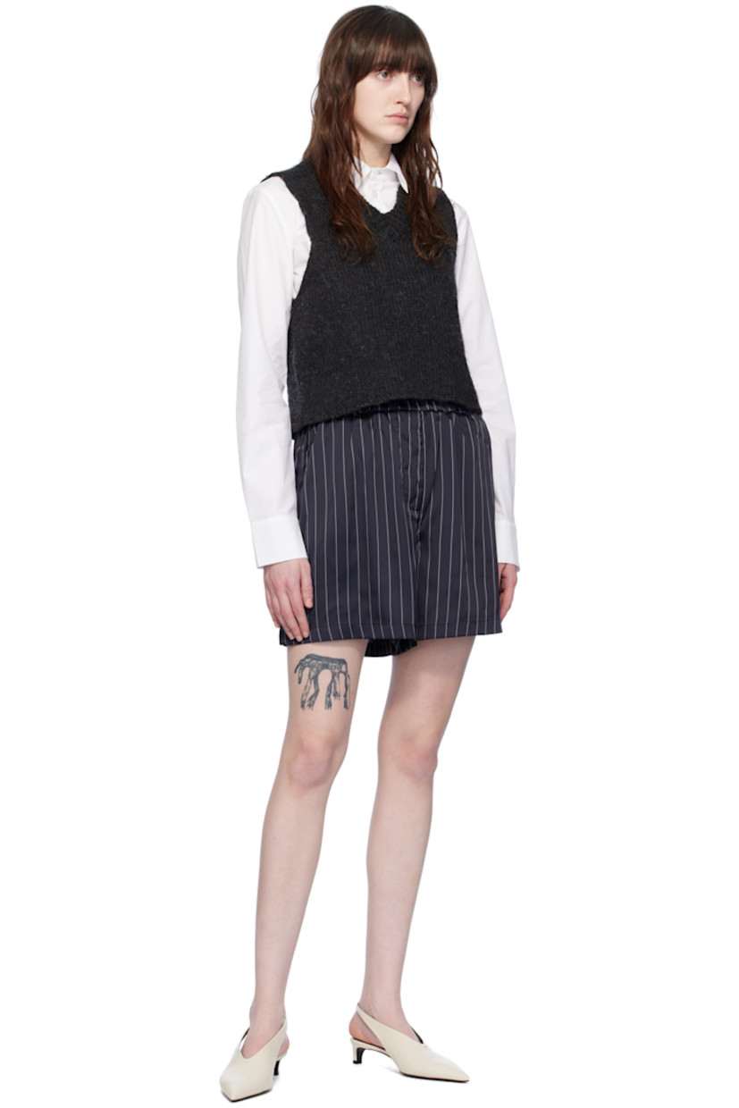 Stretch polyester satin shorts. Stripes throughout.

· Elasticized waistband
· Two-pocket styling
· Mock-fly
· Vented outseams

Supplier color: Striped navy/White