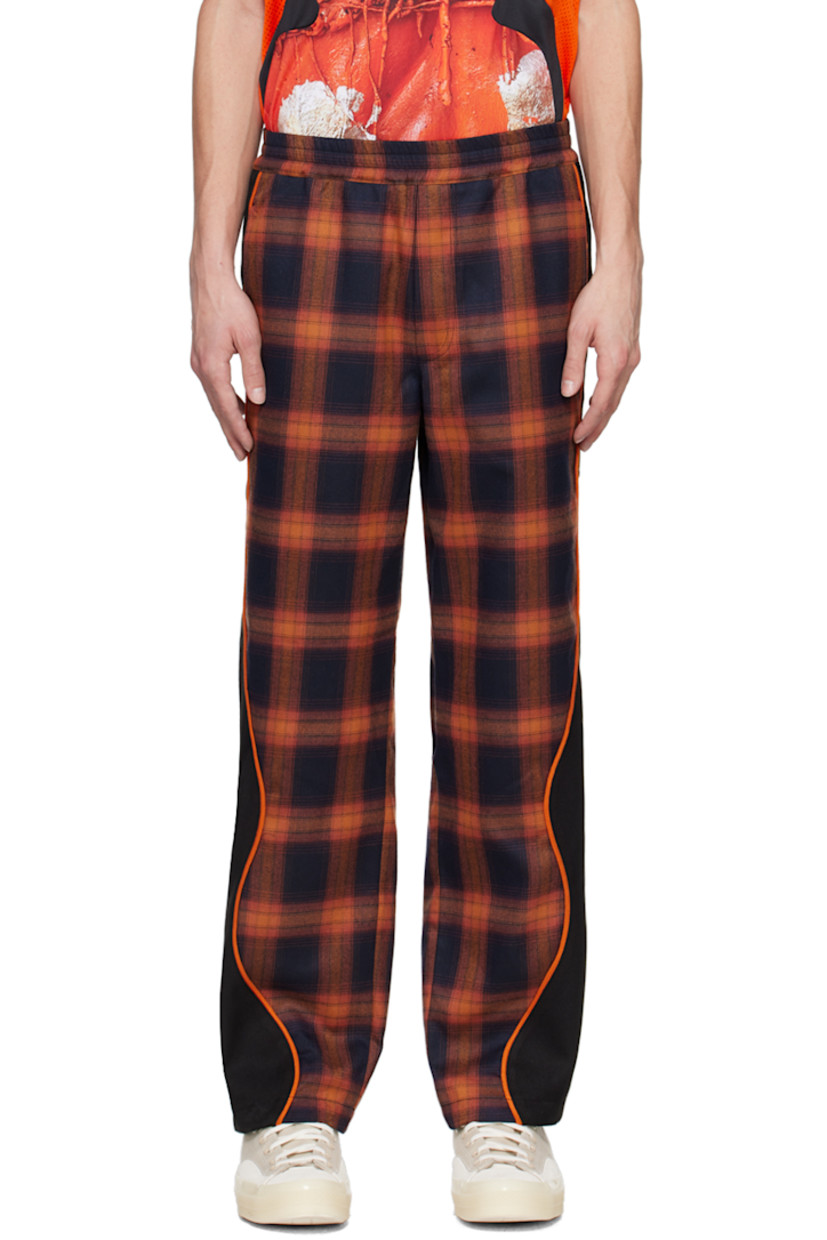 Straight-leg polyester-blend flannel and stretch polyester-blend serge track pants. Jacquard check pattern throughout.

· Paneled construction
· Drawstring at elasticized waistband
· Three-pocket styling
· Logo bonded at leg
· Piping at outseams

Supplier color: Orange plaid