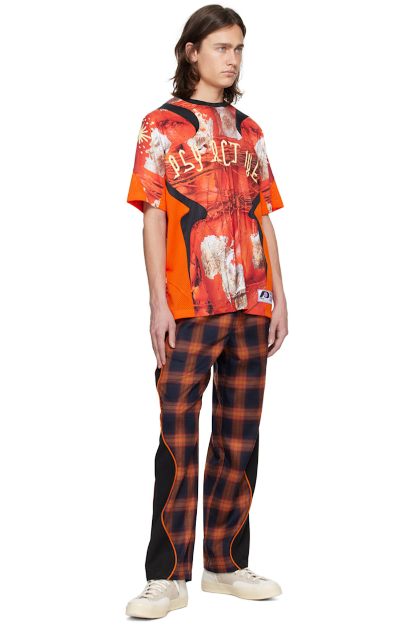 Straight-leg polyester-blend flannel and stretch polyester-blend serge track pants. Jacquard check pattern throughout.

· Paneled construction
· Drawstring at elasticized waistband
· Three-pocket styling
· Logo bonded at leg
· Piping at outseams

Supplier color: Orange plaid