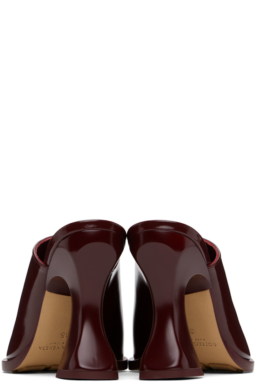 Patent calfskin slip-on heels in burgundy. 

· Pointed toe
· Slit at collar
· Logo-embossed padded lambskin footbed
· Covered spool heel with rubber injection
· Leather sole with rubber injections
· Heel: H4"

Supplier color: Merlot