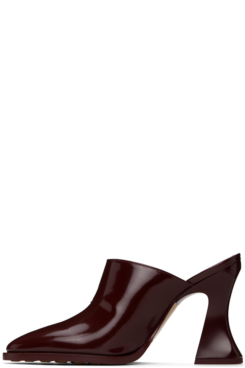 Patent calfskin slip-on heels in burgundy. 

· Pointed toe
· Slit at collar
· Logo-embossed padded lambskin footbed
· Covered spool heel with rubber injection
· Leather sole with rubber injections
· Heel: H4"

Supplier color: Merlot