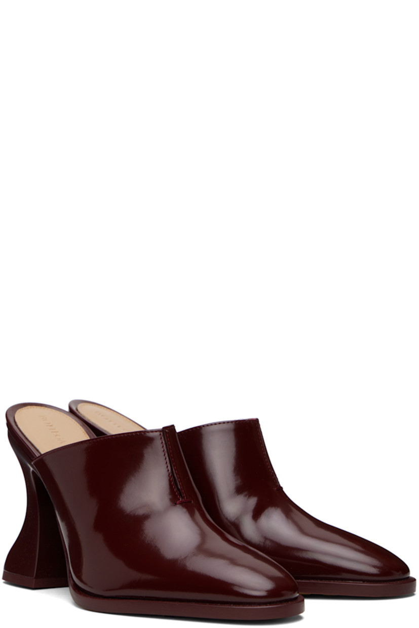 Patent calfskin slip-on heels in burgundy. 

· Pointed toe
· Slit at collar
· Logo-embossed padded lambskin footbed
· Covered spool heel with rubber injection
· Leather sole with rubber injections
· Heel: H4"

Supplier color: Merlot