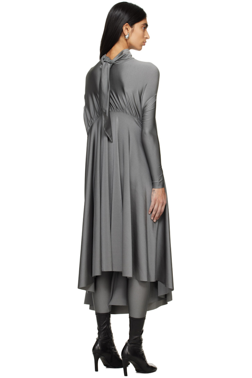 Stretch nylon lamé dress. Draping and gathering throughout.

· Self-tie fastening at turtleneck
· Dropped shoulders 
· Asymmetric hem 

Supplier color: Grey