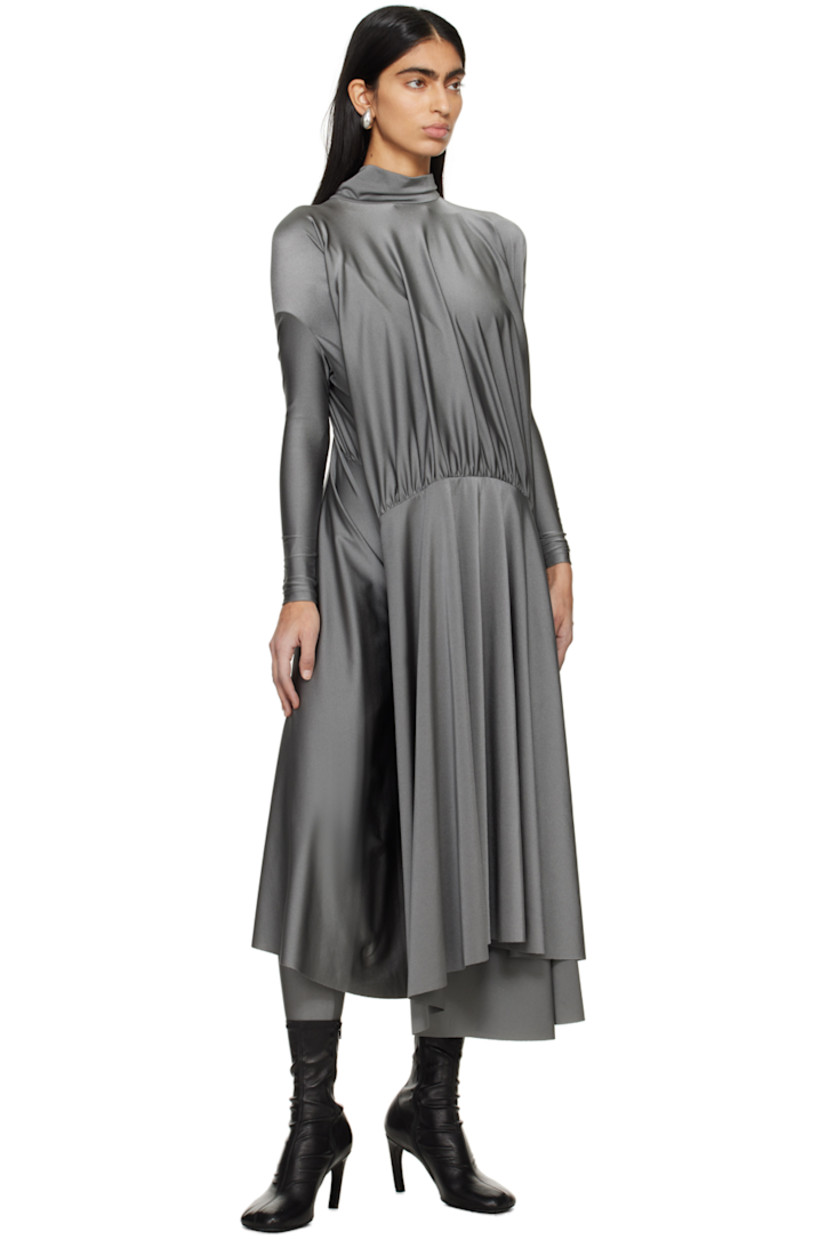 Stretch nylon lamé dress. Draping and gathering throughout.

· Self-tie fastening at turtleneck
· Dropped shoulders 
· Asymmetric hem 

Supplier color: Grey