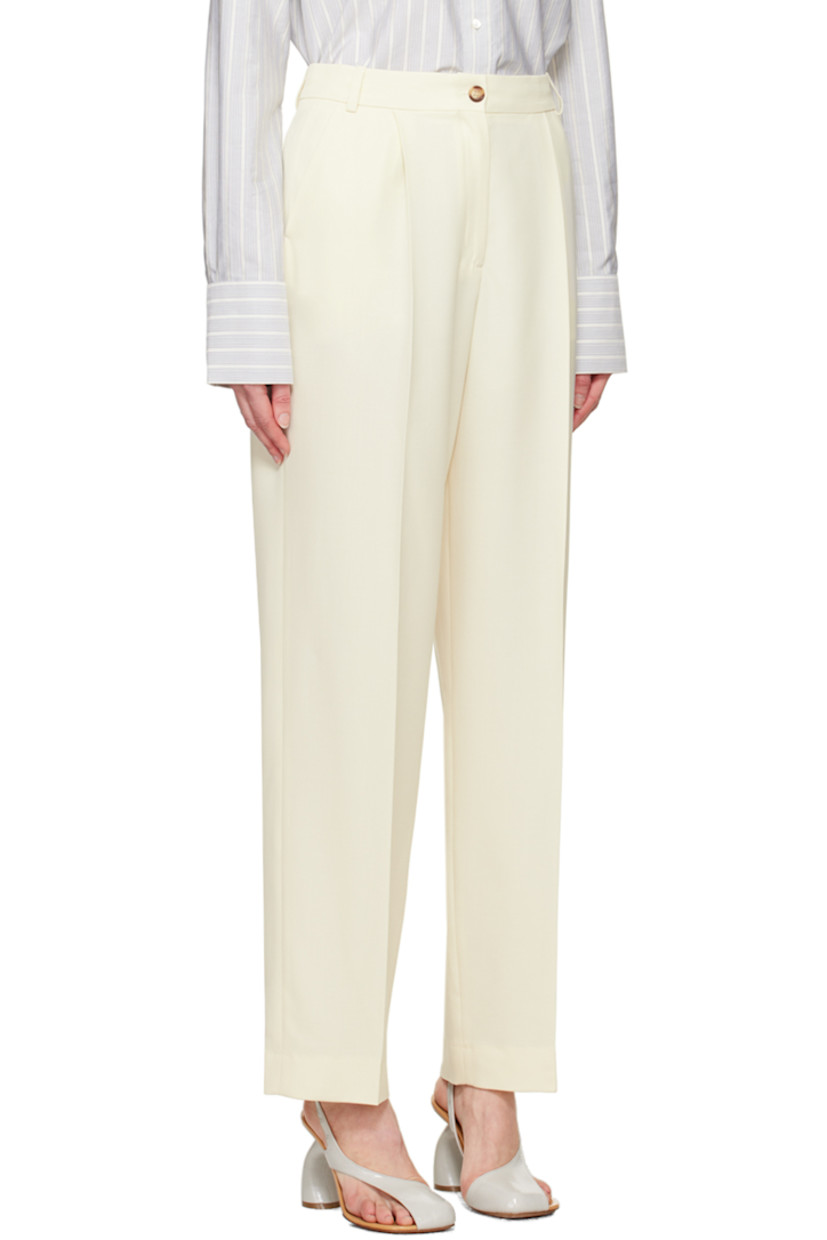 Loose-fit stretch virgin wool serge trousers.

· High-rise
· Belt loops
· Four-pocket styling
· Zip-fly
· Pleats at front
· Creased legs

Supplier color: Off-white