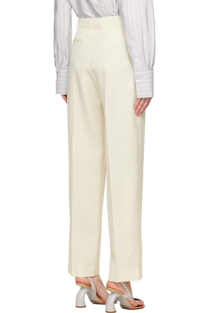Loose-fit stretch virgin wool serge trousers.

· High-rise
· Belt loops
· Four-pocket styling
· Zip-fly
· Pleats at front
· Creased legs

Supplier color: Off-white