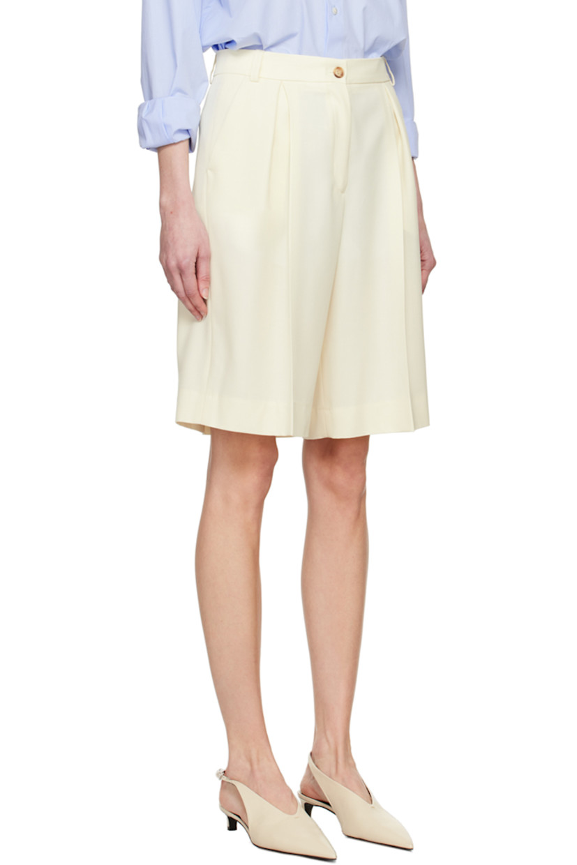 Loose-fit stretch virgin wool serge shorts.

· High-rise
· Belt loops
· Four-pocket styling
· Zip-fly
· Inverted box pleats at front
· Creased legs

Supplier color: Off white